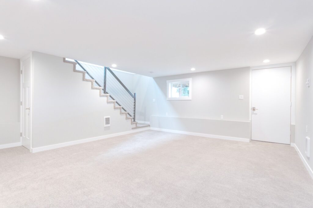 Basement floor with water damage from sump pump failure